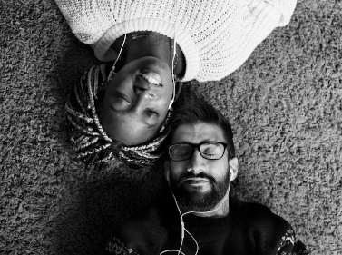 greyscale man and woman lying down